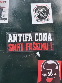 A black and red sticker with the text "Antifa Cona Smrt Fašizmu!" which translates from Croatian to "Antifa Down with Fascism!"