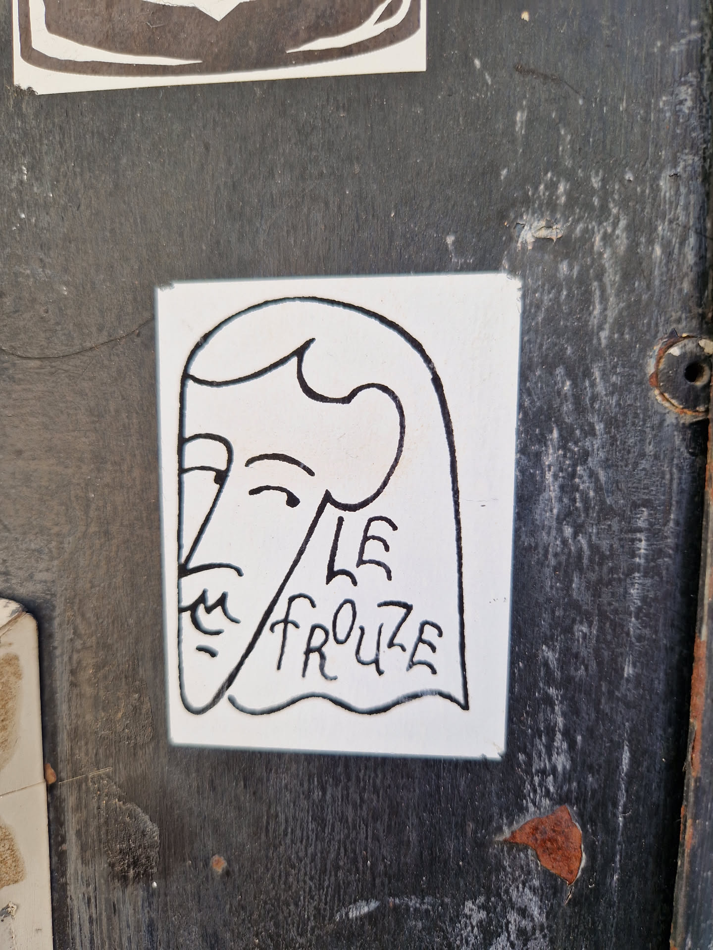 A minimalist line drawing sticker depicting a stylized female face with long hair. The text 'LE FROUZE' is written beneath the face.