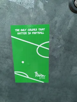 Green football sticker with a minimalist design. It shows a football field with a ball and the text "The only colors that matter in football".  The sticker also includes the logo for "Bajen Tribe".