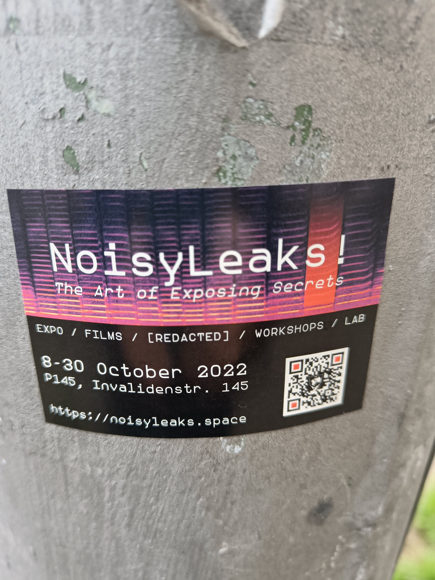Sticker for an event called NoisyLeaks, which seems to be about exposing secrets.  It lists an expo, films, workshops and a lab. The event took place from the 8th to the 30th of October 2022 at P145, Invalidenstr. 145.  A QR code is included that links to https://noisyleaks.space