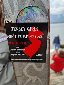 A black and red sticker promoting a music event featuring Dave Weber, Johnny Honolulu, and the Tremolo Kings.  The sticker includes a graphic of the state of New Jersey and social media links to YouTube and Facebook.