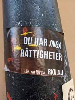 A sticker featuring a scale of justice and text stating 'You have no rights'.  The sticker directs people to the website RKU.nu for more information.