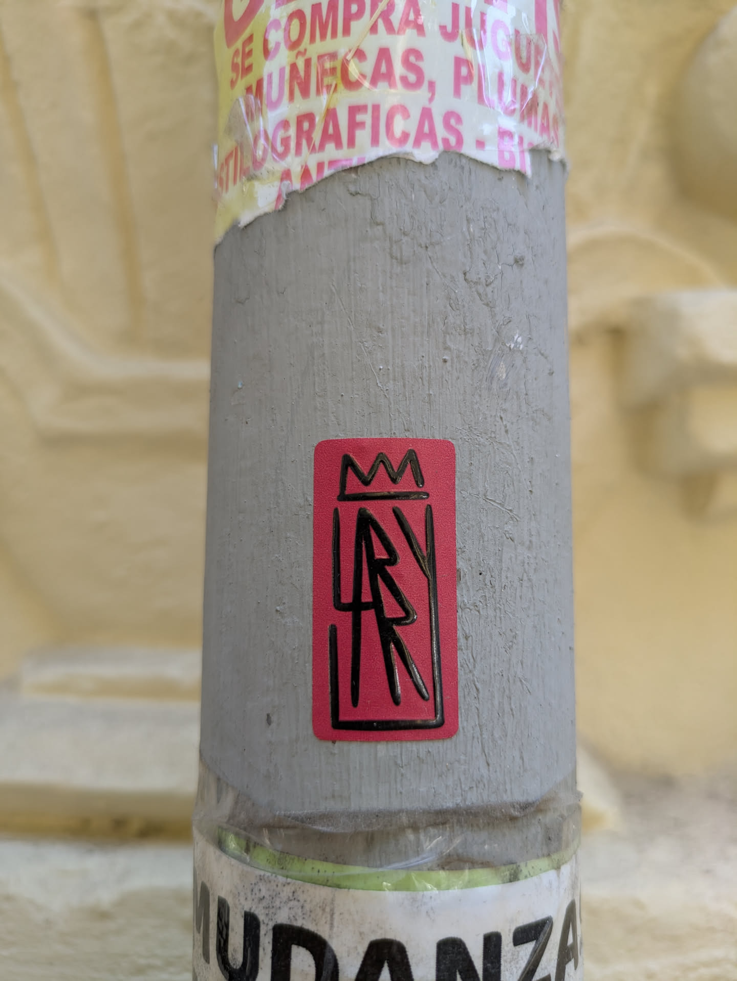 This sticker features a red background with a black border. Inside the border, there's a simplified crown at the top and the letters 'AR' stacked vertically, also in black. The design is minimalist and graphic.