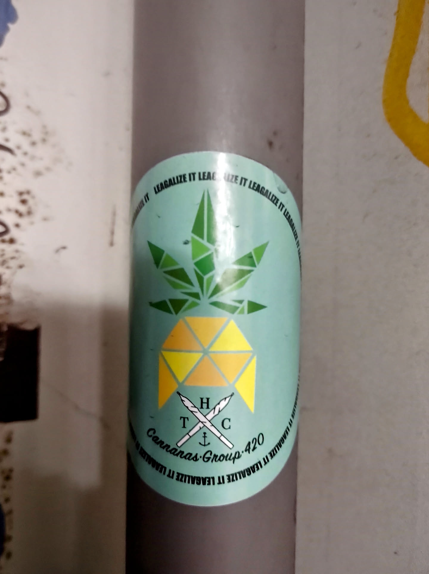 Round sticker with a teal background featuring a geometric pineapple design incorporating a cannabis leaf. The text includes 'Cannanas Group 420' and the phrase 'Legalize it' repeated around the circumference.  There is also a small logo with the letters 'THC' and an anchor.