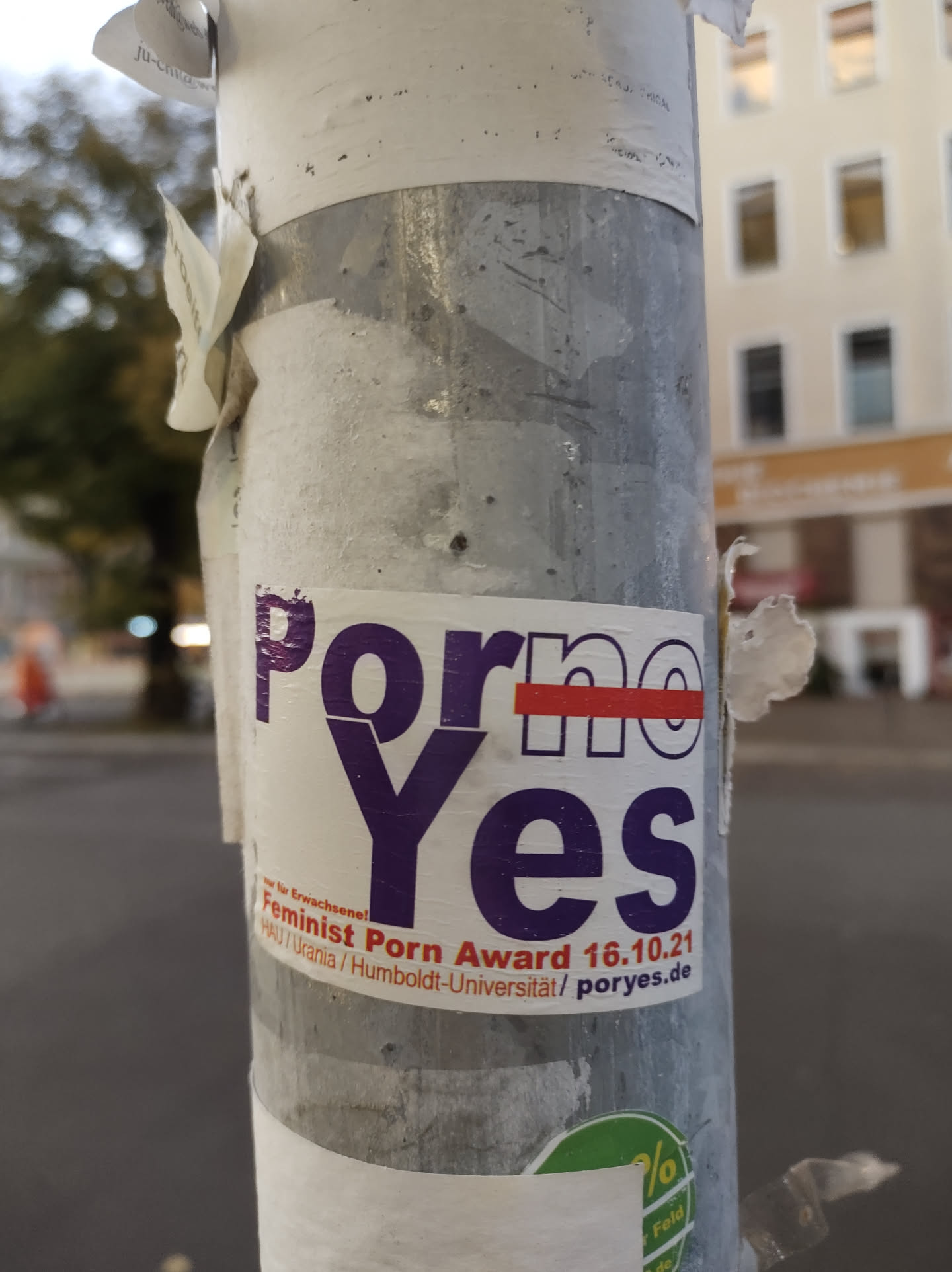 A sticker promoting the Feminist Porn Award on a pole.  The word "no" is crossed out in the sticker's design.