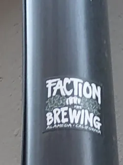 A sticker for Faction Brewing, located in Alameda, California.  The sticker features the brewery's name in stylized graffiti-like lettering with a graphic element that looks like hops.