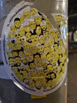 Round sticker with many yellow and black illustrated portraits of hip-hop artists. The text 'HipHopKleurboek.nl' is visible around the edge.