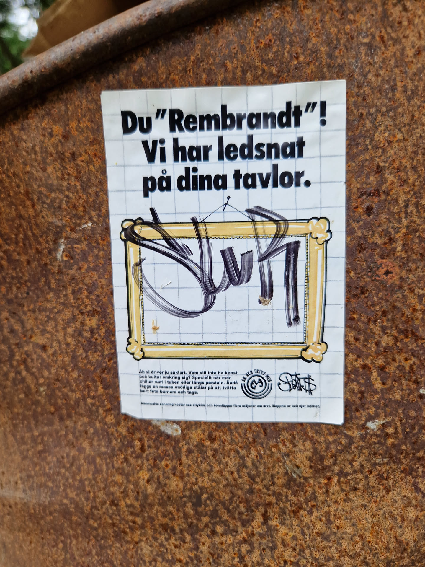 A sticker featuring a drawing of a graffiti-style artwork within a picture frame, overlaid on a grid background. The text translates from Swedish to: "You "Rembrandt"! We are tired of your paintings."