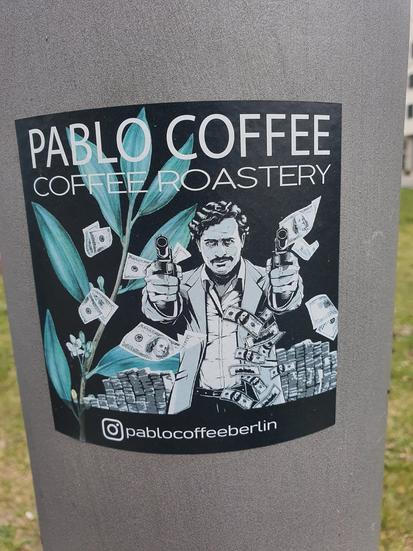 Sticker featuring an illustration of Pablo Escobar holding guns surrounded by money and coffee plant. The sticker is black and white with teal accents. It has the Instagram handle @pablocoffeeberlin at the bottom.