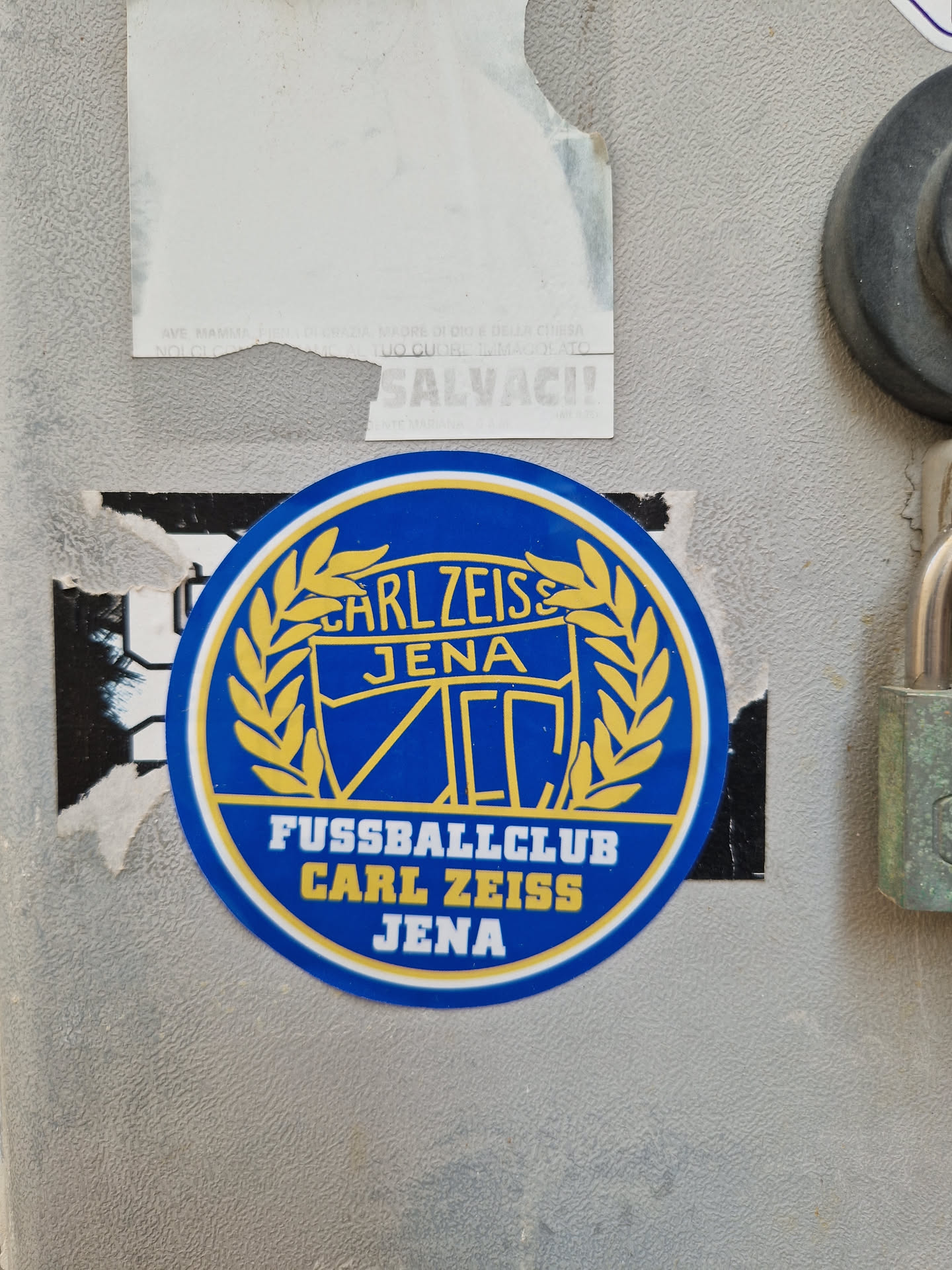 A round blue and gold sticker featuring the logo of Fussballclub Carl Zeiss Jena. The logo includes the team's name, a crest, and a laurel wreath.