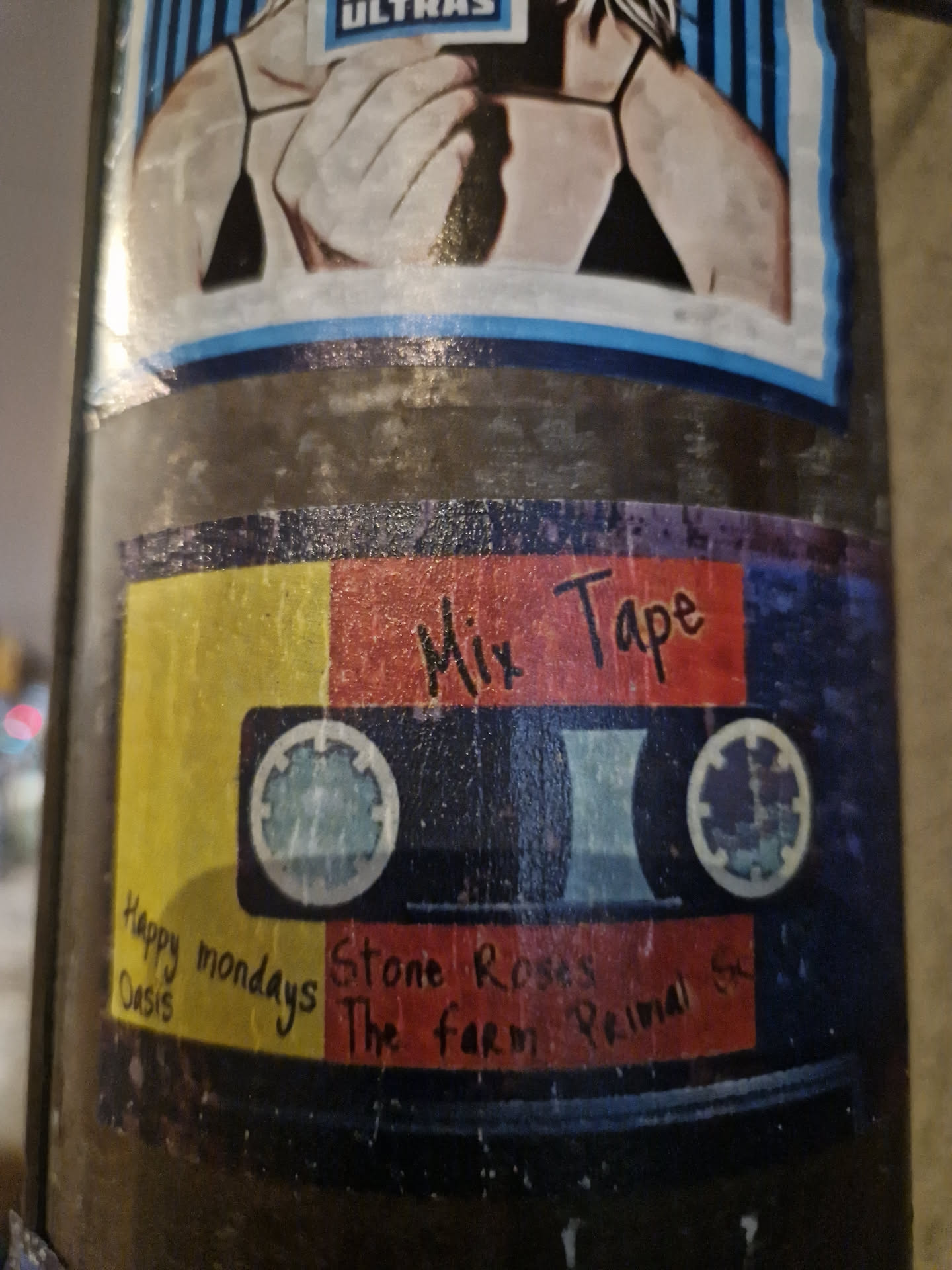 A sticker design resembling a cassette tape with the text 'Mix Tape' at the top.  The bottom features handwritten names of bands: Oasis, Stone Roses, The Farm, Primal Sc. 