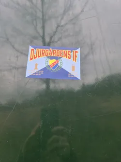 A Djurgården IF sticker featuring the club's logo and various years. The sticker is blue, red, yellow and white.