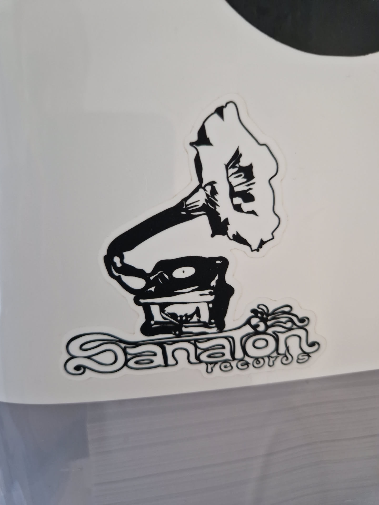 A black and white sticker with a drawing of a gramophone and the text 'Danalon Records'. The design is simple yet evocative of vintage music.