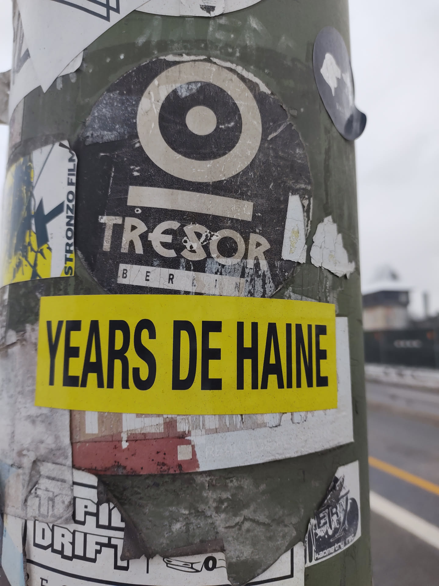 A yellow sticker with the text "YEARS DE HAINE" over a round Tresor Berlin sticker. The Tresor sticker features its logo and the text "Tresor Berlin".