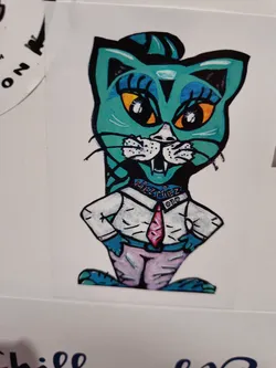 This sticker features a teal cat wearing a collared shirt and tie. The cat has exaggerated features, including large eyes and a stylized hairdo. The art style is reminiscent of cartoons or graffiti art.