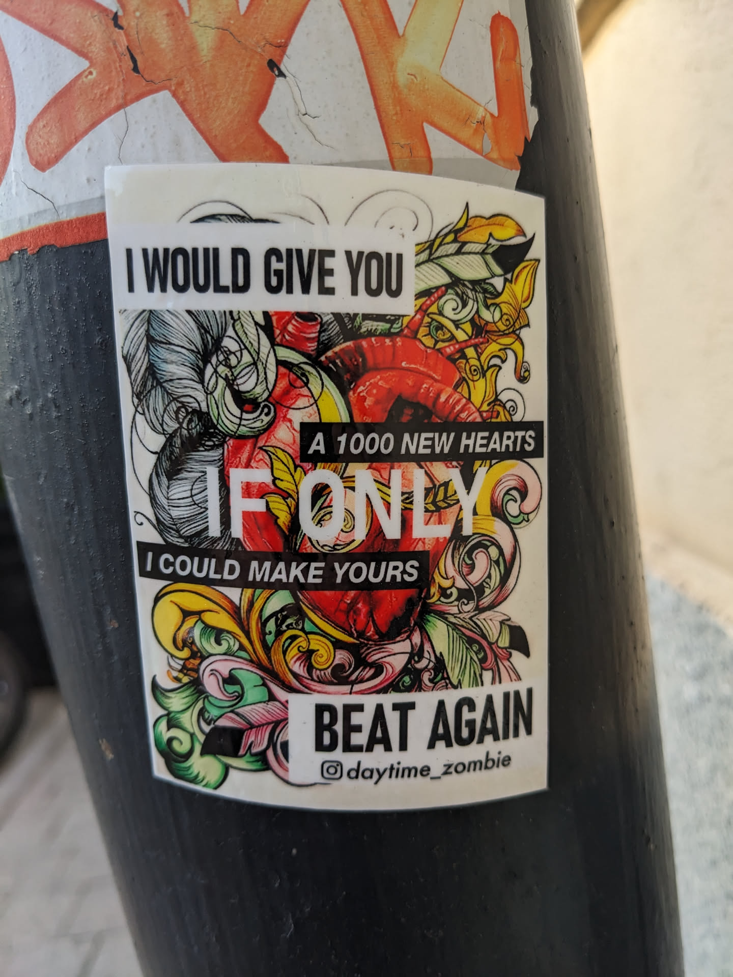 A sticker with an illustration of a heart and ornate design. The text on the sticker is a romantic message.