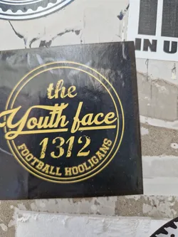 Black and gold sticker with a circular design. The text 'The Youth Face 1312 Football Hooligans' is written in a vintage style font. 