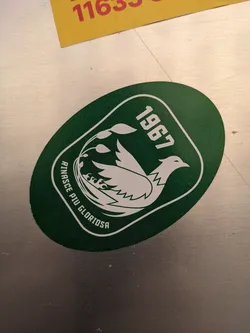Green and white sticker featuring a bird design and the year 1967. The text "Rinasce Più Gloriosa" is visible.