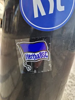 A sticker featuring a blue and white flag with the text "HerthaBSC".