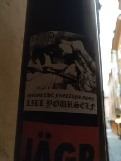 Black and white sticker with a graphic image and text. The text says  "Follow the freezing moon, kill yourself!"