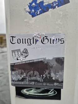 A black and white sticker featuring a crest and the words "Tough Guys est. 1992".  The German text, "Die Austria wird euch alle überleben!" (Austria will outlive you all!), is also present. The sticker displays imagery possibly referencing football/soccer, with a banner saying "No Surrender".