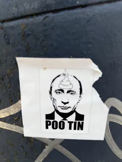 A sticker depicting Vladimir Putin with a pile of poop on his head. The text below the image says "Poo Tin".