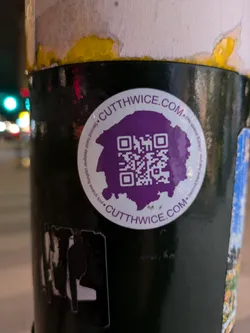 A purple and white sticker with a QR code in the center.  The text on the sticker says Cutthwice.com and describes it as a secondhand clothing search tool.