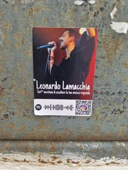 Sticker featuring a picture of Leonardo Lamaccha, a singer, with a Spotify code and a QR code linking to his social media.