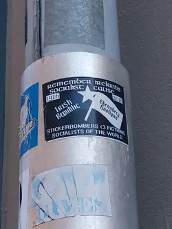 A sticker commemorating the Irish socialist cause from 1916 to 2016. It features the Irish Republic flag and text mentioning Ekensberg Hooligan and Stickerbombers. The sticker also contains a message of solidarity with fighting socialists of the world.