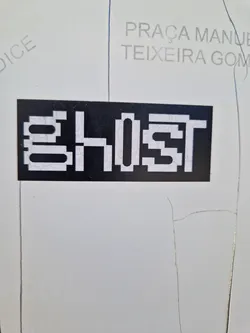 A black and white pixel art sticker with the word ghost on it.