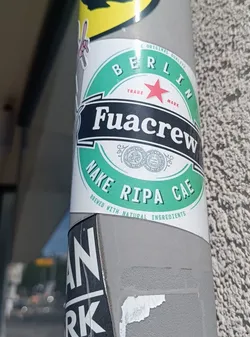 A sticker featuring a design reminiscent of a beer label.  The text reads 'Fuacrew Nake Ripa Cae' and includes 'Berlin' and mentions that it's brewed with natural ingredients.
