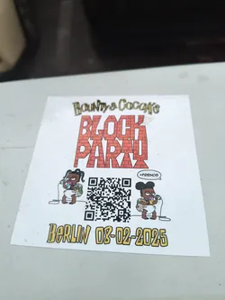 The sticker features cartoon babies resembling characters from 'The Simpsons' alongside a QR code and the event details.