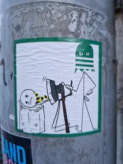 This sticker features a simple yet eerie illustration. A green, ghost-like figure with stripes is depicted holding an axe over a smaller figure with a yellow and black striped scarf, seemingly trapped within a log. The style is minimalistic, using black outlines and simple shapes to create a somewhat unsettling scene.