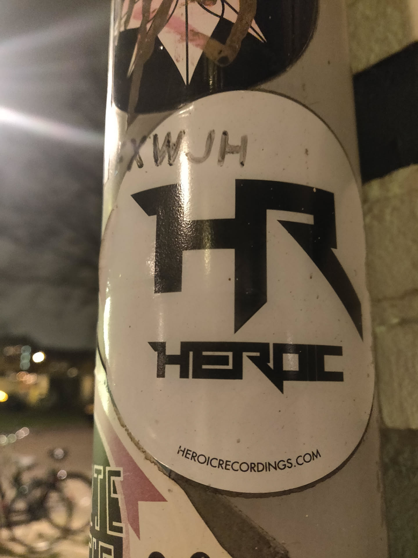 Round sticker with the Heroic Recordings logo. The logo is a stylized "HR" with the word "HEROIC" underneath. The website HEROICRECORDINGS.COM is printed at the bottom of the sticker.