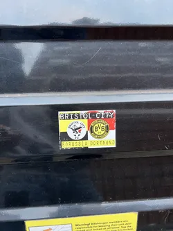 A rectangular sticker featuring a combined design of two football clubs. The sticker has a slightly worn appearance with minor scuffs and dust. The top left section displays 'BRISTOL CITY' in black text on a white background. Below this, the left half of the sticker features the Bristol City FC crest, which is a black circle with 'BRISTOL CITY' text, a robin bird, and 'FC' below it, all set against a background of yellow and black vertical stripes. The right half of the sticker showcases the Borussia Dortmund (BVB) logo, a yellow circle with 'BORUSSIA BVB 09 DORTMUND' text, placed on a background of red and black vertical stripes. At the very bottom of the sticker, 'BORUSSIA DORTMUND' is written in black text on a yellow background. The overall color scheme is dominated by yellow, black, white, and red.