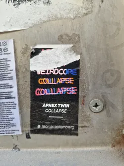 A sticker featuring Aphex Twin's Collapse artwork with a glitch effect. The sticker also includes the artist's Instagram handle.