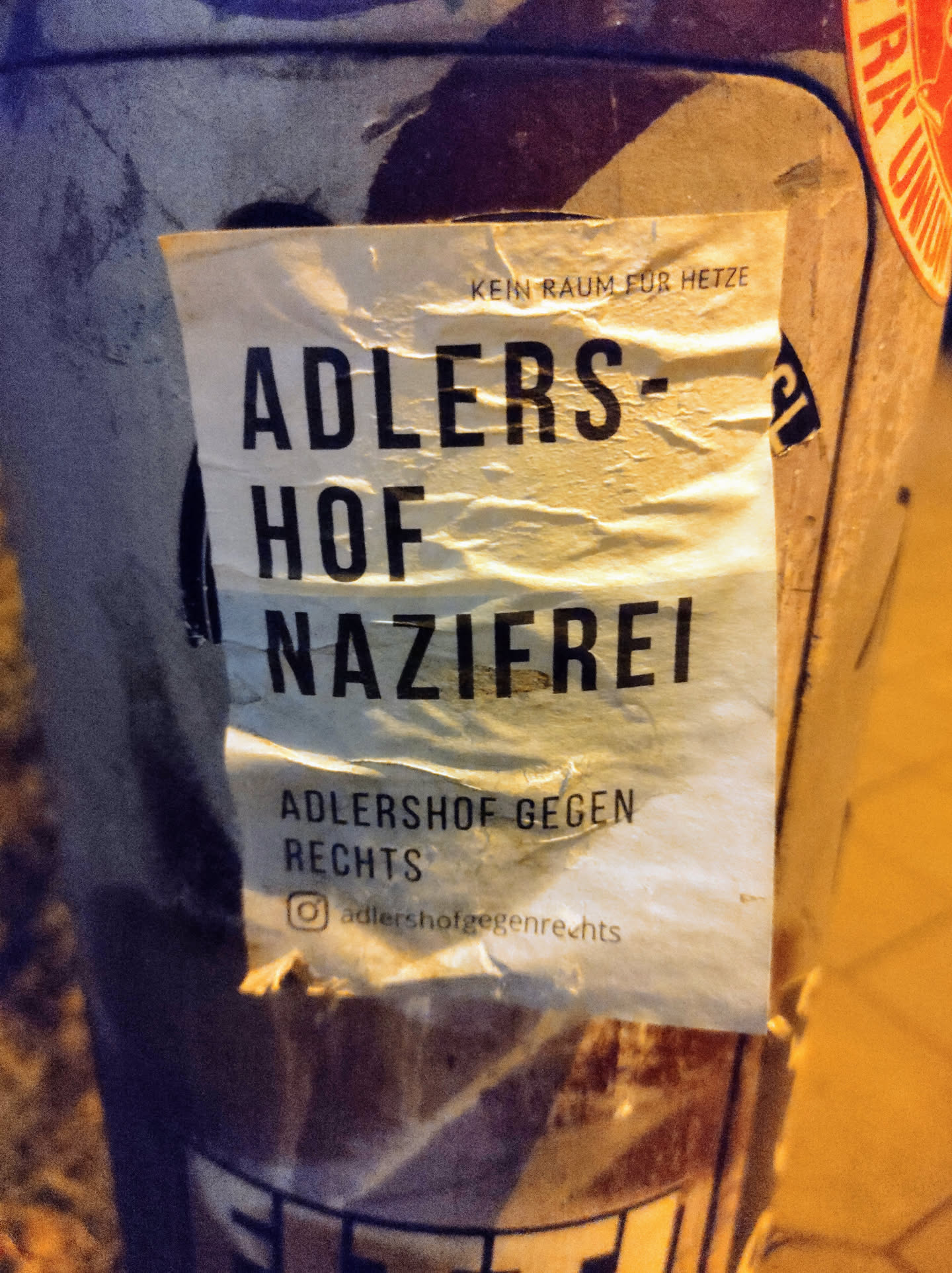 Sticker promoting Adlershof against the right. It says Adlershof Nazifrei (Adlershof Nazi-free) and Kein Raum für Hetze (No room for incitement).  There is an Instagram handle at the bottom.