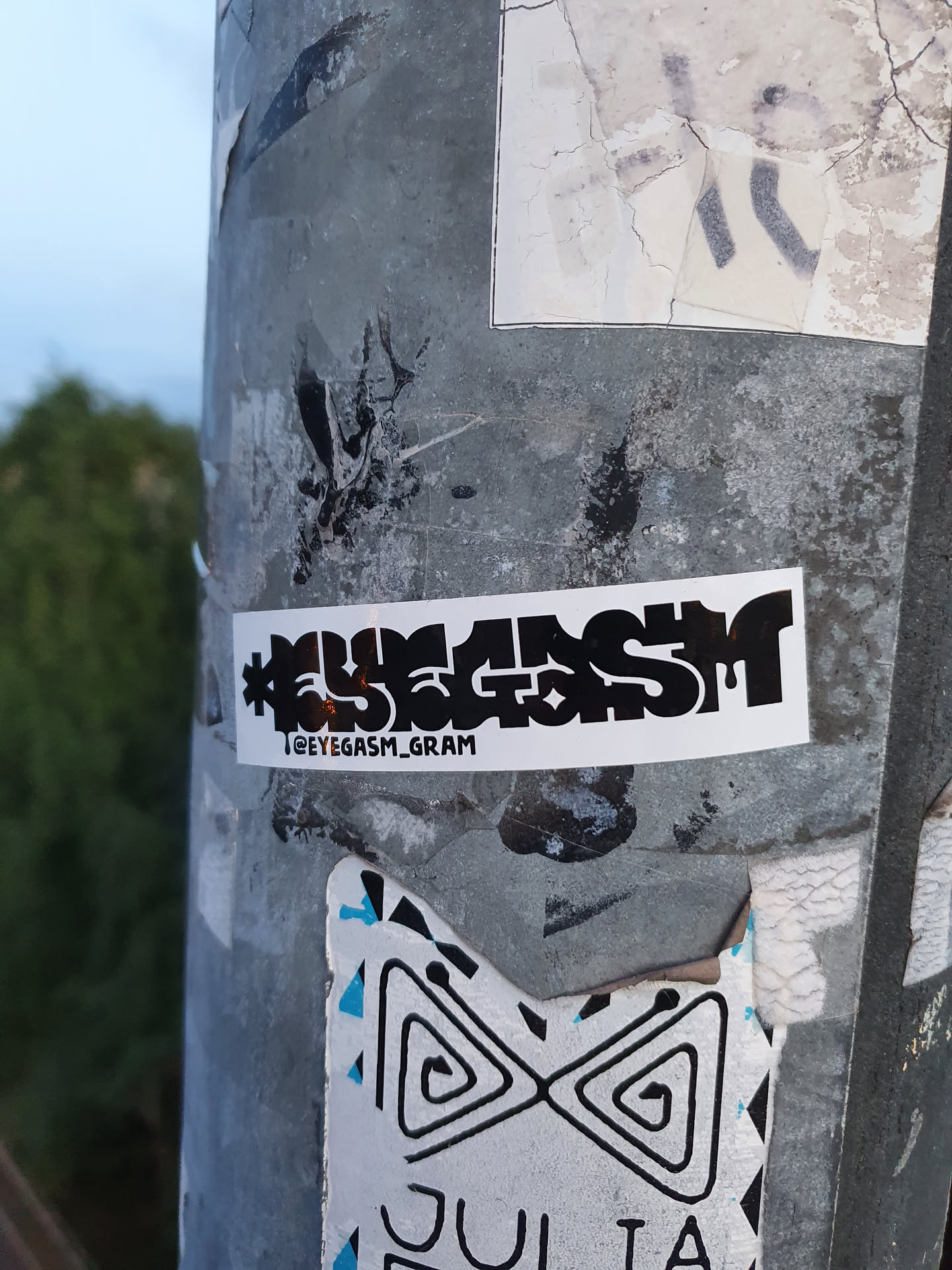 Black and white sticker with the text "#EYEGASM" and the Instagram handle "@EYEGASM_GRAM".