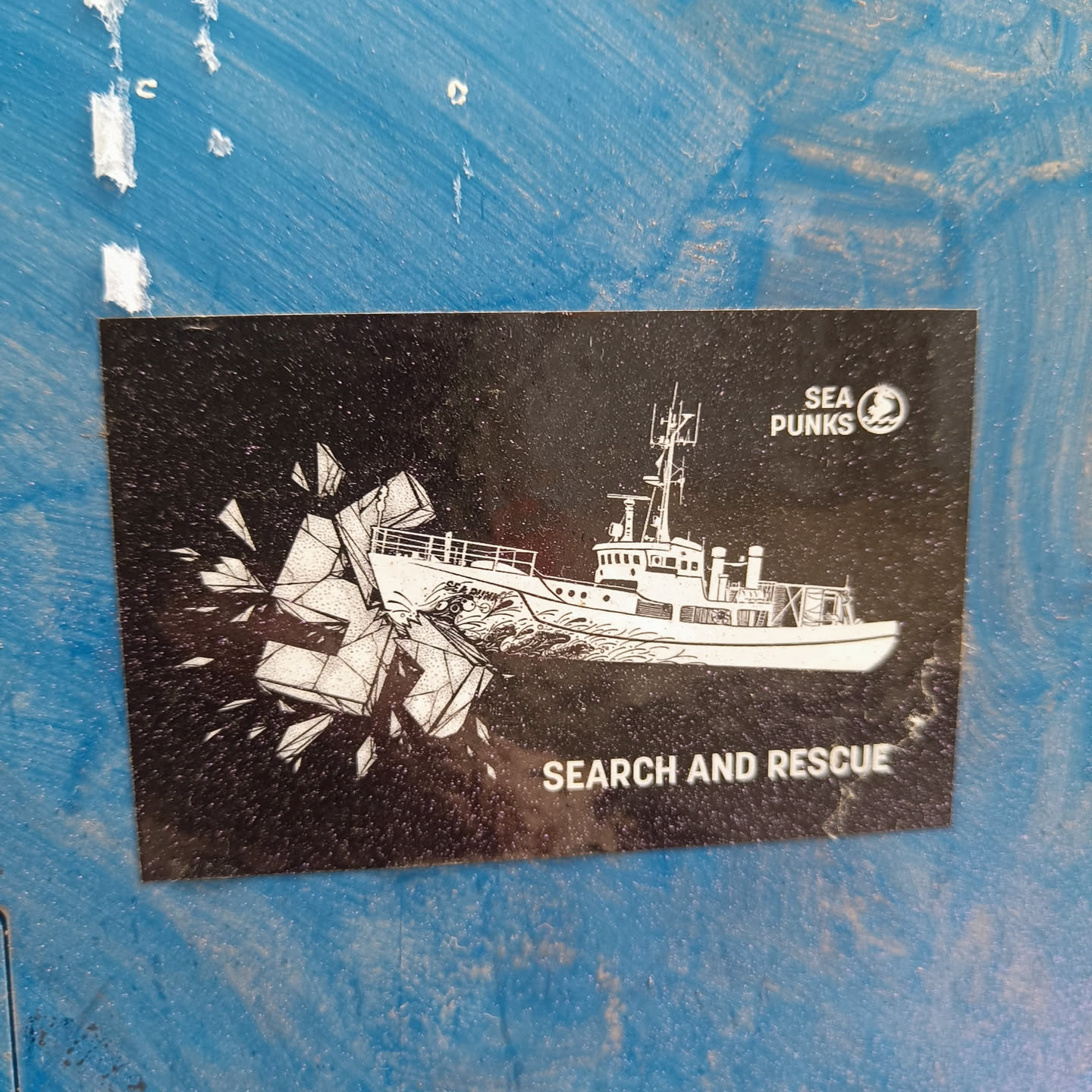 Black and white sticker depicting a ship breaking ice. The text "SEARCH AND RESCUE" is at the bottom and "SEA PUNKS" logo is at the top right corner.