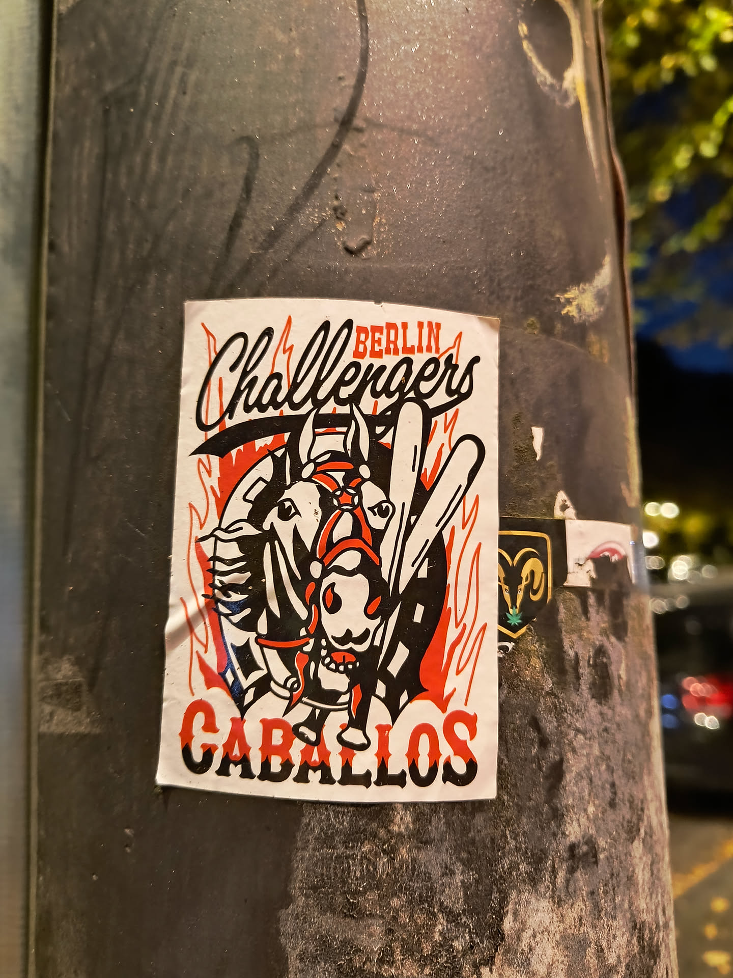 Sticker featuring a design with two horses and a rider, set against flames. The text 'BERLIN Challengers' is at the top, and 'CABALLOS' at the bottom. The style is reminiscent of vintage sports team logos or illustrations.