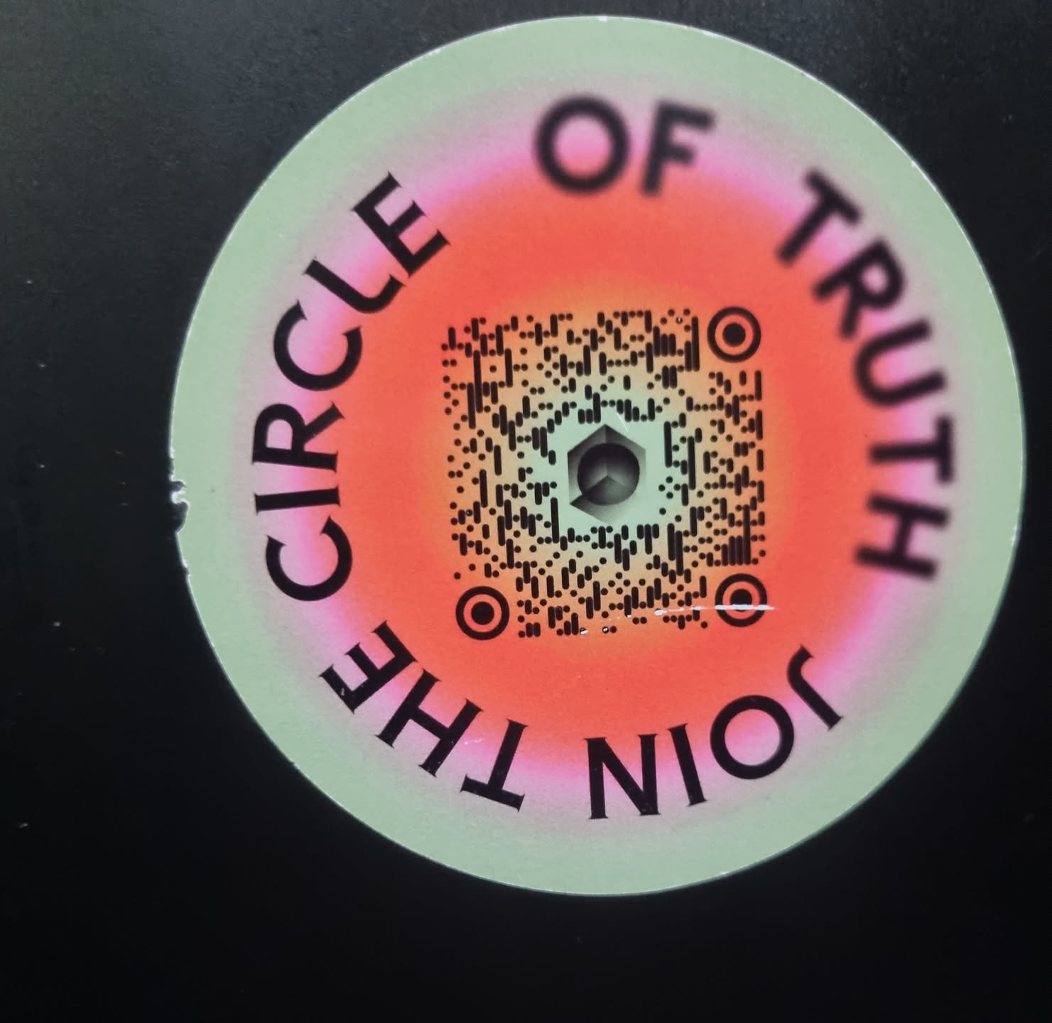 Round sticker with a QR code in the center. The text "Join the Circle of Truth" is written around the QR code.