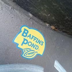 A yellow and blue Baffins Pond sticker affixed to a dark gray surface. The sticker features the company's logo, which includes the name 'Baffins Pond' in a stylized font and two stylized leaves.