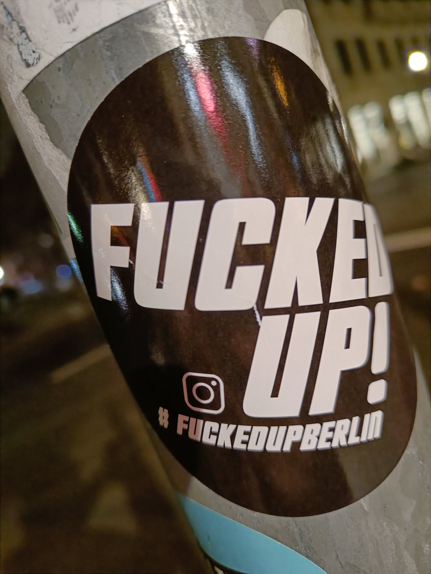 A black and white sticker with the text "FUCKED UP!" in bold white letters on a black background.  Below the text is an Instagram logo and the hashtag #fuckedupberlin.