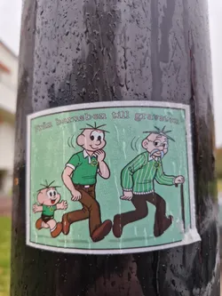 A sticker depicting three figures in different stages of life, from a child to an elderly man. The style is reminiscent of classic comic strips. The figures are walking and dressed in green and brown clothes.