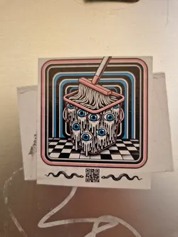 A sticker featuring a bucket with eyes being mopped. The design is in a retro style with a checkerboard floor and concentric circles in the background.  Two snakes flank a QR code at the bottom.
