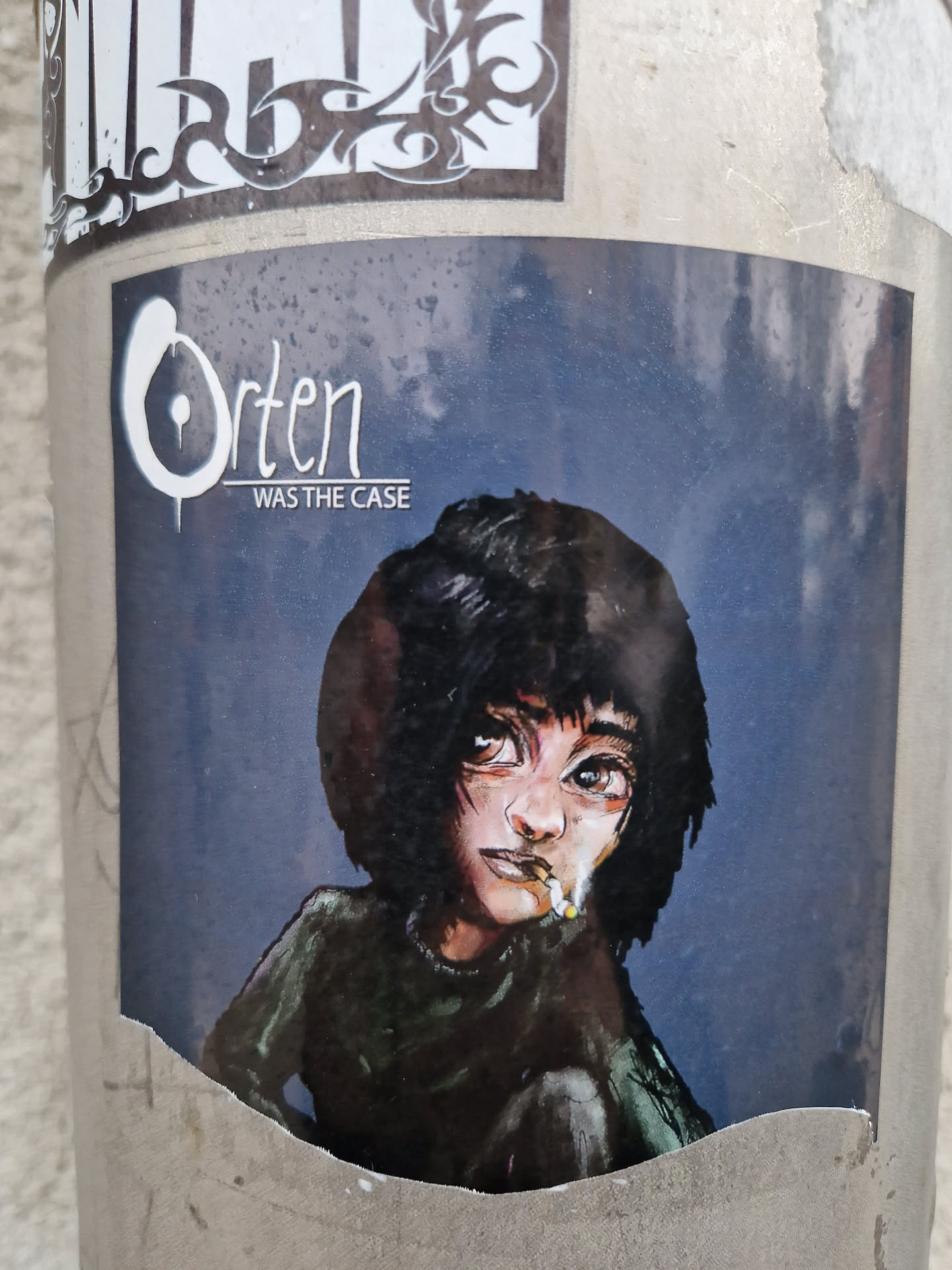 A sticker featuring a stylized illustration of a young person with short dark hair, appearing thoughtful while holding a cigarette. The artwork has a dark color scheme and a slightly grunge aesthetic. The text "Orten Was The Case" is prominently displayed above the illustration. 