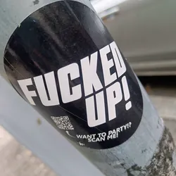 A black and white round sticker with the text "FUCKED UP!" in large, bold, white letters. Below the main text, it says "WANT TO PARTY!? SCAN ME!" with a QR code next to it.