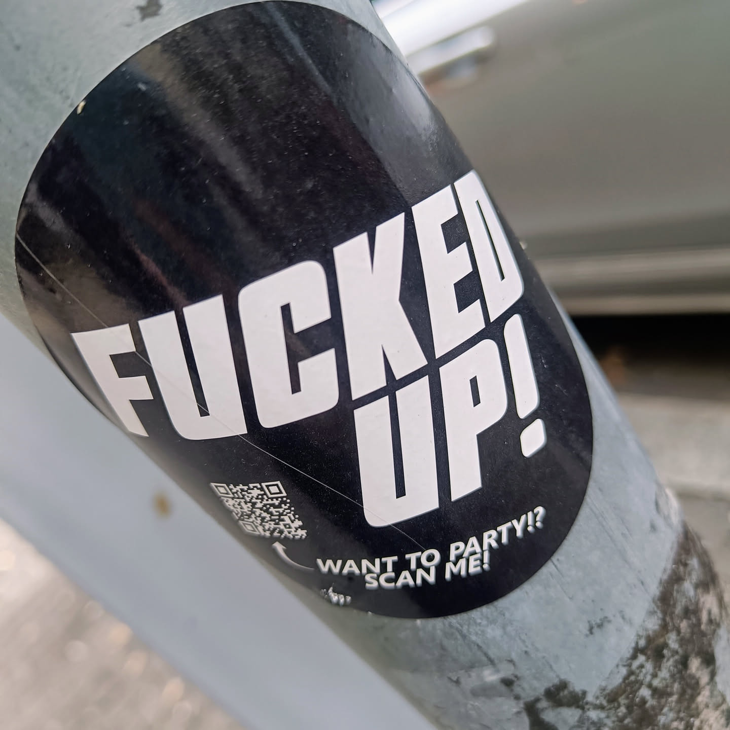 A black and white round sticker with the text "FUCKED UP!" in large, bold, white letters. Below the main text, it says "WANT TO PARTY!? SCAN ME!" with a QR code next to it.