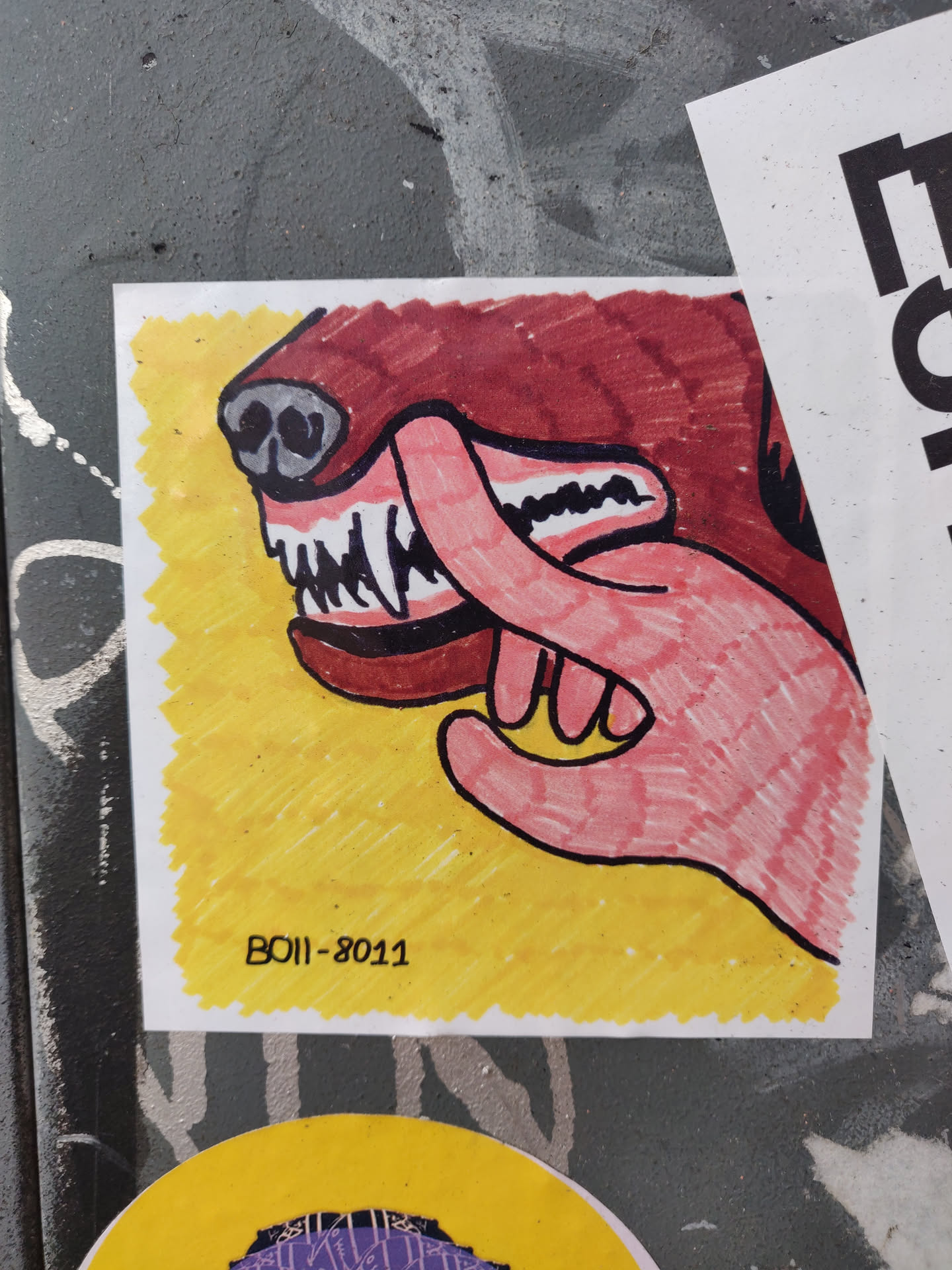 This sticker features a cartoon drawing of a hand interacting with a dog's mouth. The style is simplistic and slightly edgy, with a color palette of reds, yellows, and pinks. The artist's signature or code, 'BO11-8011' is visible in the bottom corner.
