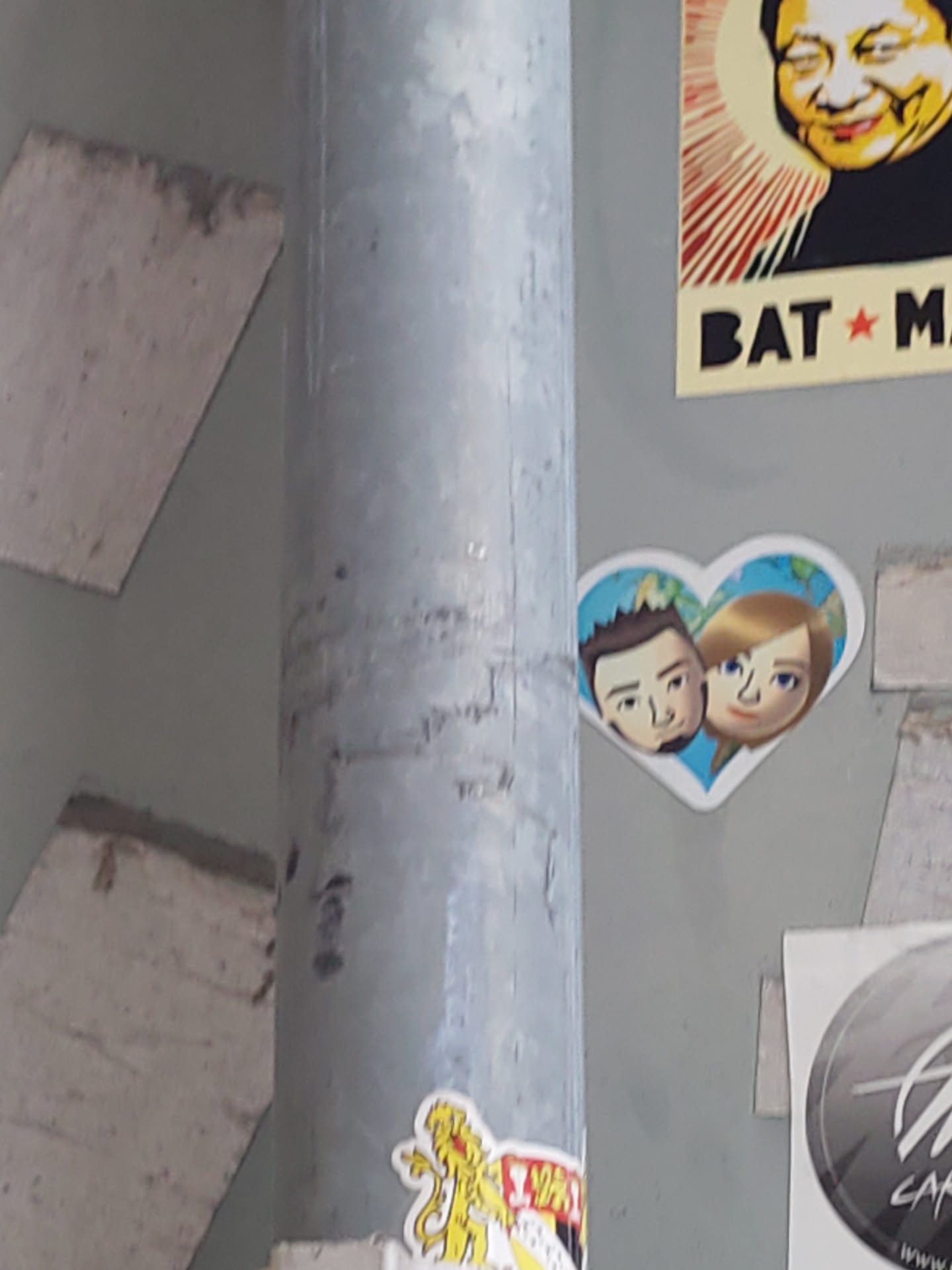 A sticker featuring a cartoon couple in a heart shape. The style is simple and sweet.